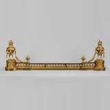 Antique Louis XVI style gilt bronze fire fender with urns on fire