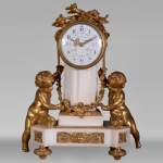 Louis XVI style little clock with putti by Perrineau