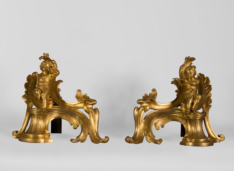 Superb pair of Louis XV period gilt bronze andirons with putti blowing soap bubbles, 18th-century original gilt-0