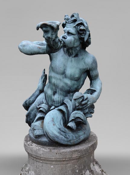 Important Louis XIV style pair of Tritons sounding a conch shell in bronze with green patina