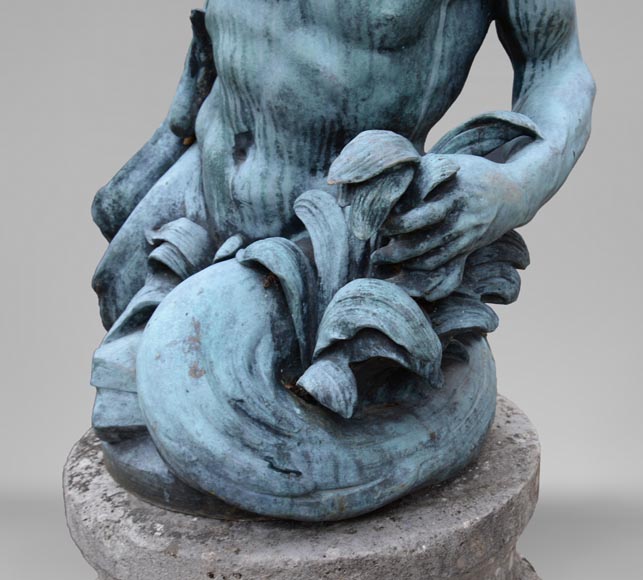 Important Louis XIV style pair of Tritons sounding a conch shell in bronze with green patina