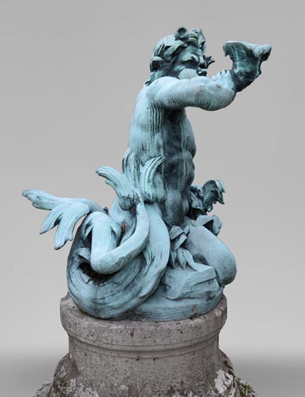 Important Louis XIV style pair of Tritons sounding a conch shell in bronze with green patina