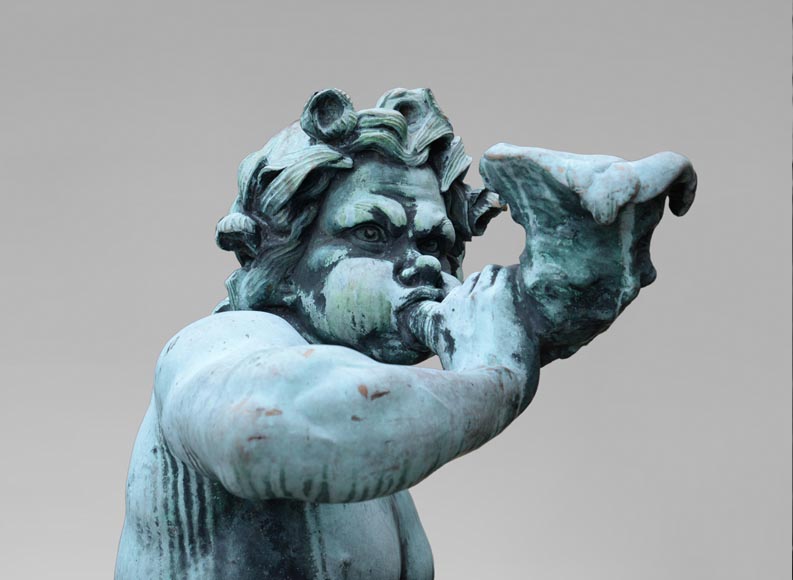 Important Louis XIV style pair of Tritons sounding a conch shell in bronze with green patina