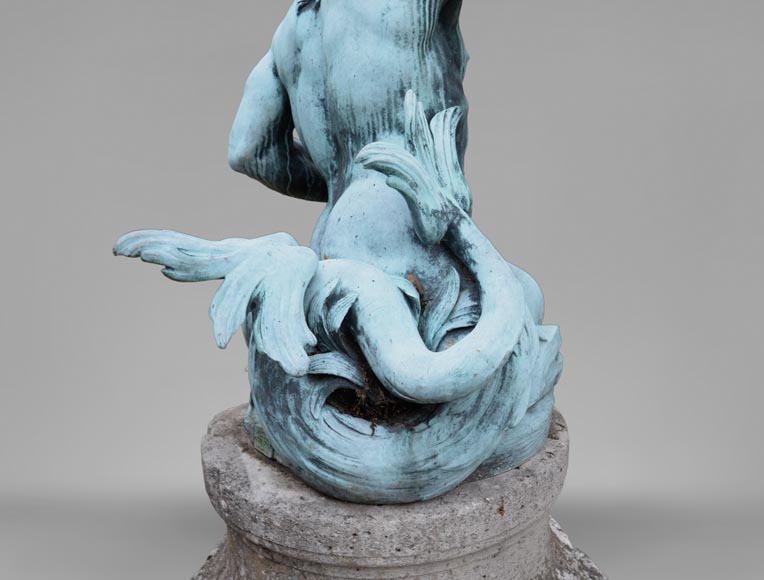 Important Louis XIV style pair of Tritons sounding a conch shell in bronze with green patina