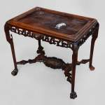 Japanese style table, openwork wooden friezes, top decorated with a japanese hunter