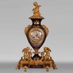 Napoleon III style clock, in Sèvres night blue porcelain and gilded bronze