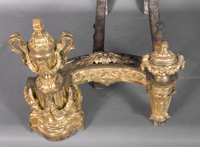 Beautiful pair of antique Louis XVI style andirons in gilt bronze from the 19th century decorated with vases and floral garlands-5