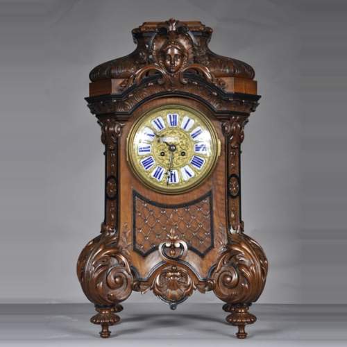 Mazarov (attributed to), Neo-Renaissance carved walnut cartel clock