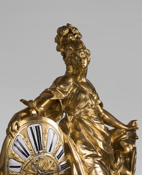 Gilded bronze clock, signed LEROLLE Frères Paris, showing Minerva presenting her shield-1