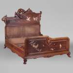Antique bed of Far Eastern inspiration with engraved and inlaid bone decoration