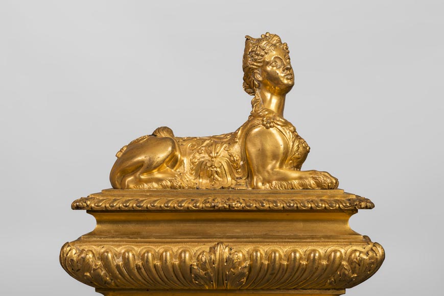 Henry Dasson, Pair of chenets with sphinges, Regency style, in gilded bronze, 1882-5