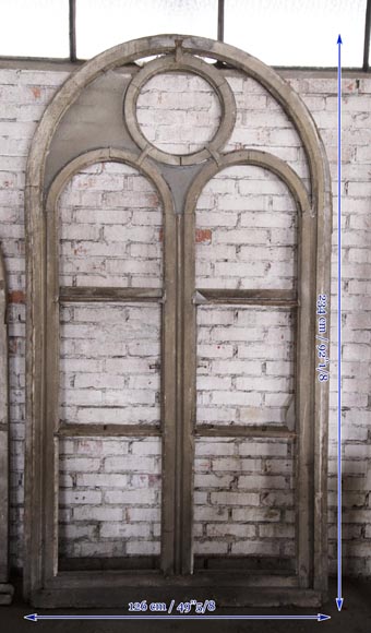 Arched wooden window frames and coloured glass-3