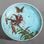 Théodore DECK (ceramist) and Anthony Ludovic REGNIER (painter) - Ceramic dish glazed with striped lily and butterfly on a blue background