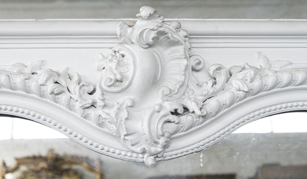 An antique Louis XV style overmantel with asymetric shell and crossbow pediment-1