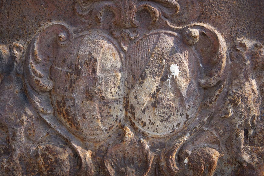 An old 18th century fireback with coat of arms and sitting lions-2