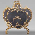 Antique Louis XV style fire screen in gilt bronze
