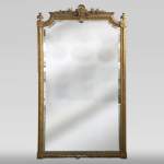 Antique gilded Trumeau, Napoleon III style, with a bevelled mirror