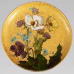 MANUFACTURE DE SÈVRES - WALTER Glazed ceramic plate decorated with flowers on a gold background