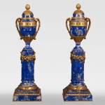 Charles Varangoz - A Louis XVI style lapis lazuli pair of candlesticks