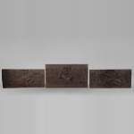 Set of three antiques carved walnut decorative panels with attributes of the Arts