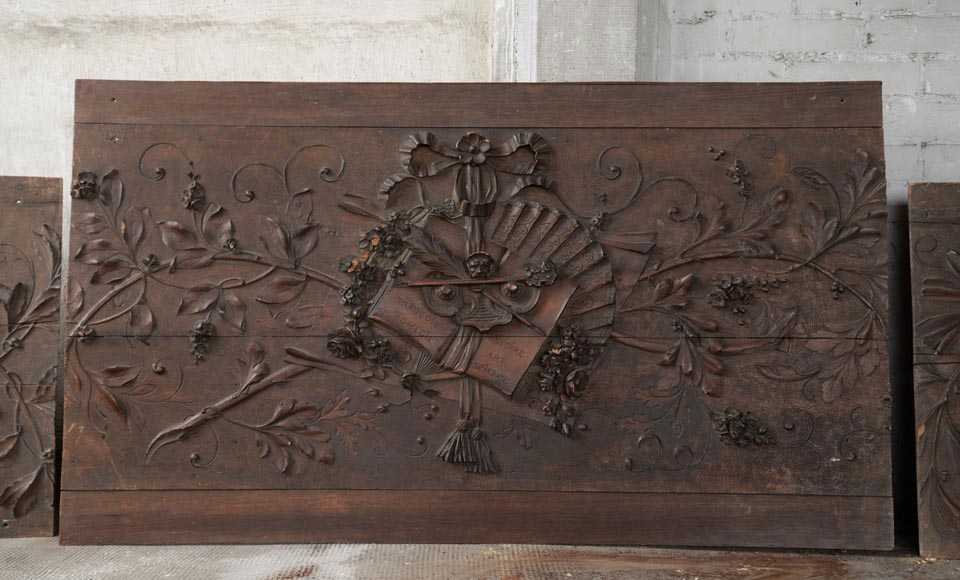 Set of three antiques carved walnut decorative panels with attributes of the Arts-1