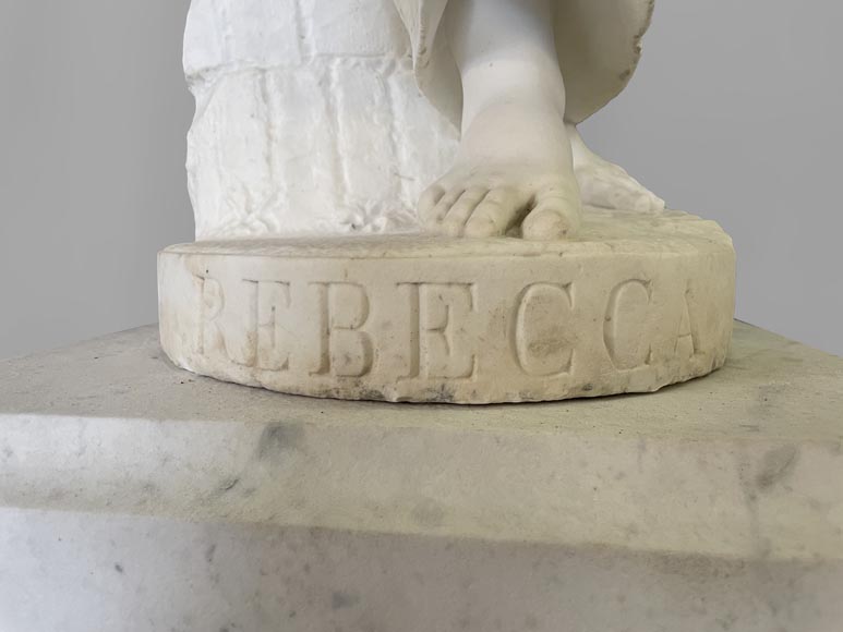 Two white marble statues representing 