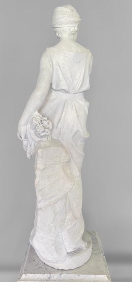 Two white marble statues representing 