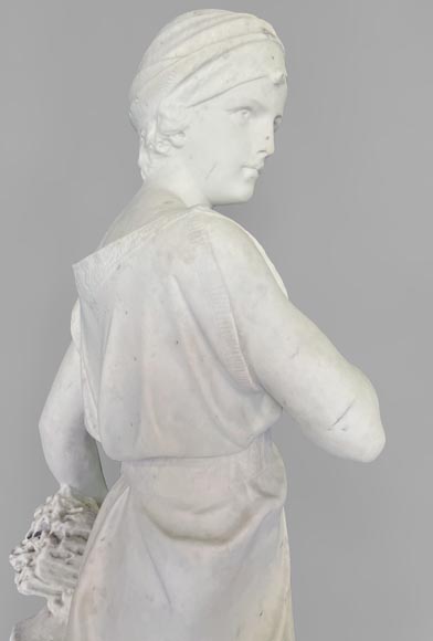 Two white marble statues representing 