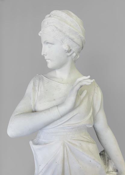 Two white marble statues representing 