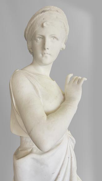 Two white marble statues representing 