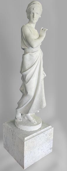 Two white marble statues representing 