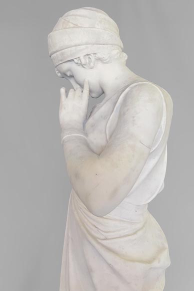 Two white marble statues representing 