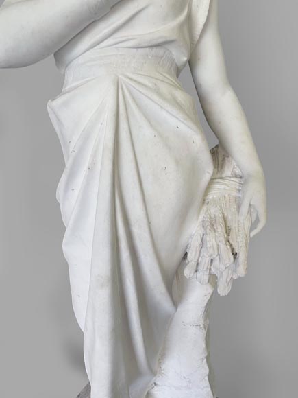 Two white marble statues representing 