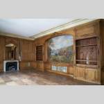 Louis XV oak paneled room with its fireplace and a canvas by Paul Tavernier