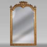Antique Napoleon III style trumeau in gilded stucco and bevelled mirror