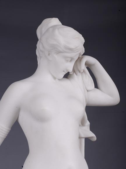 Peach blossom marble and gilt bronze clock surmounted by a statuary white marble   sculpture representing Phryne in front of his judges, signed 