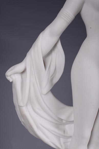 Peach blossom marble and gilt bronze clock surmounted by a statuary white marble   sculpture representing Phryne in front of his judges, signed 