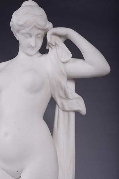 Peach blossom marble and gilt bronze clock surmounted by a statuary white marble   sculpture representing Phryne in front of his judges, signed 