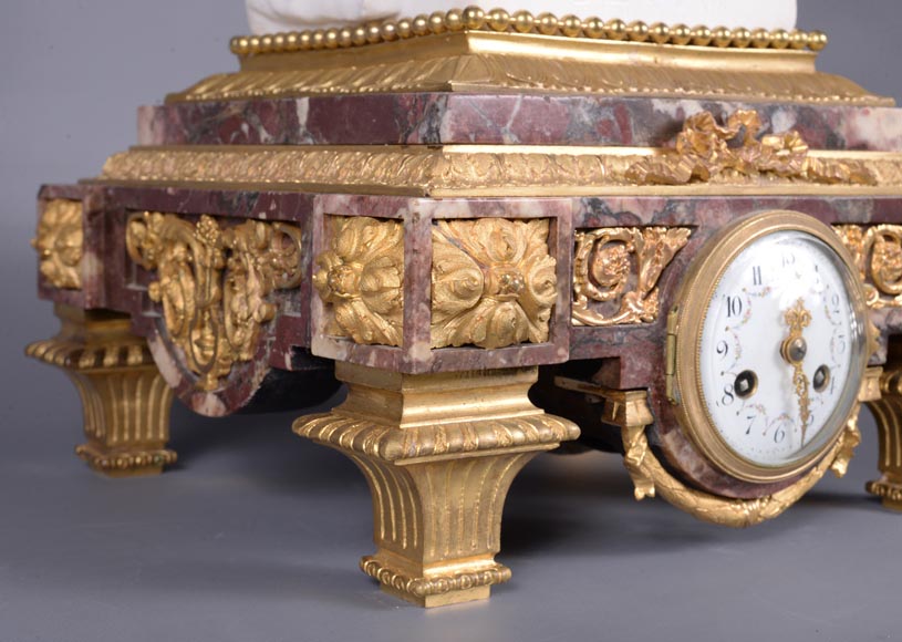 Peach blossom marble and gilt bronze clock surmounted by a statuary white marble   sculpture representing Phryne in front of his judges, signed 