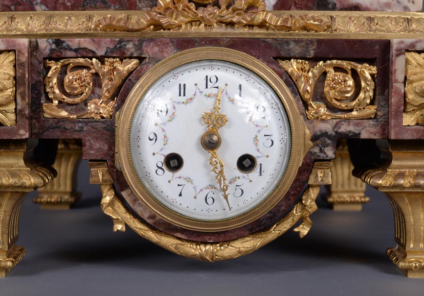 Peach blossom marble and gilt bronze clock surmounted by a statuary white marble   sculpture representing Phryne in front of his judges, signed 