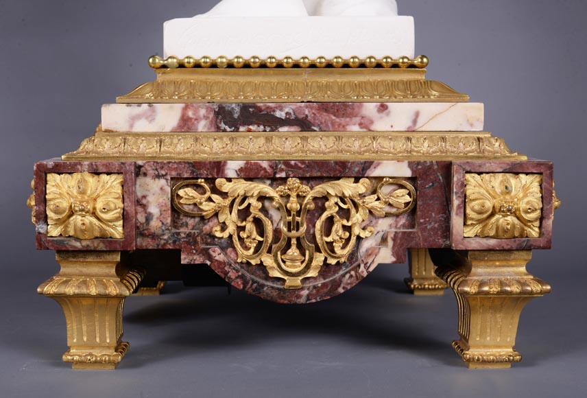 Peach blossom marble and gilt bronze clock surmounted by a statuary white marble   sculpture representing Phryne in front of his judges, signed 