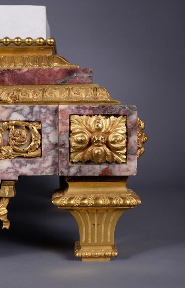 Peach blossom marble and gilt bronze clock surmounted by a statuary white marble   sculpture representing Phryne in front of his judges signed 