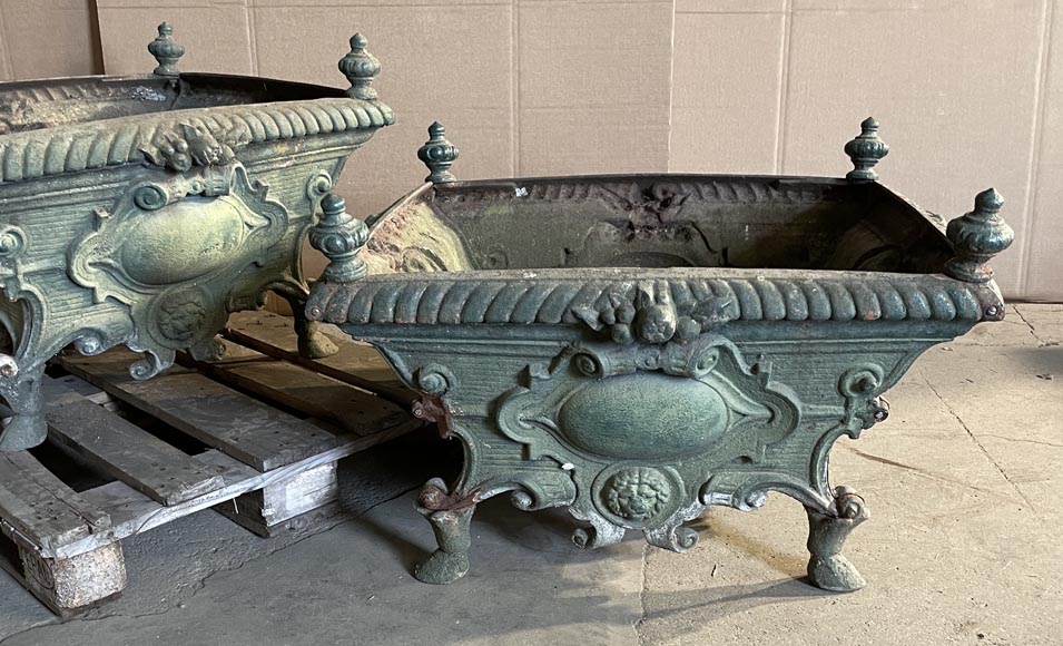 Pair of cast iron planters decorated with cartouches and lion heads Pair of cast iron planters decorated with cartouches and lion heads-2