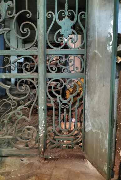 Old wrought iron entrance door of a Napoleon III period mansion.-7