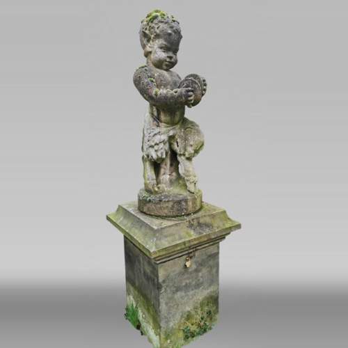 Statue of a young musician faun in composite stone, 20th century