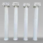 Four Ionic-style columns in plaster