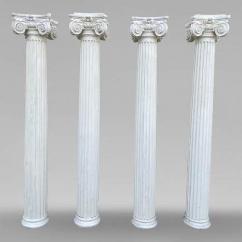 Four Ionic-style columns in plaster