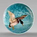 Théodore DECK (1823-1891), Earthenware dish with a flying mallard