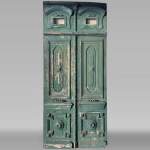  Large double door in wood painted in green and pediment, 20th century