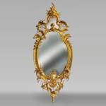 Rich Napoleon III rococo style mirror in gilted bronze